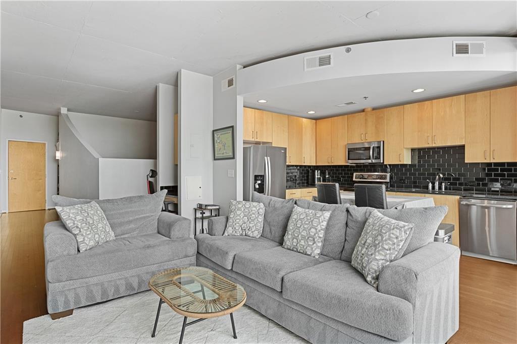 361 17th Street Northwest, Unit 2115 Atlanta, GA 30363 - Photo 2 of 24 a view of living room kitchen with furniture and kitchen view