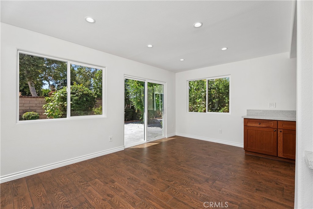 30 Entrada West Irvine, CA 92620 - Photo 16 of 41 a view of an empty room with wooden floor and a window