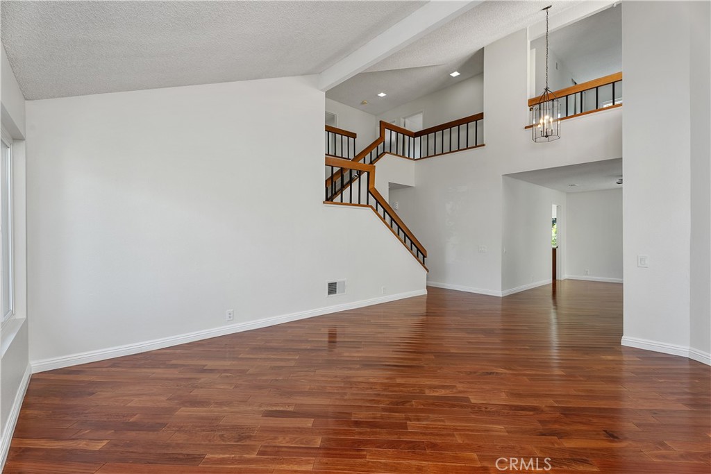 30 Entrada West Irvine, CA 92620 - Photo 4 of 41 a view of an entryway with wooden floor