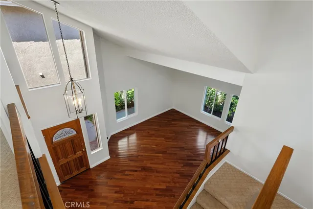 a view of an entryway with wooden floor