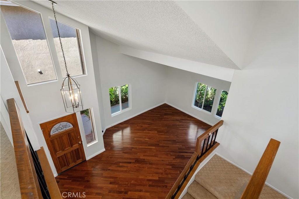 30 Entrada West Irvine, CA 92620 - Photo 5 of 41 a view of an entryway with wooden floor