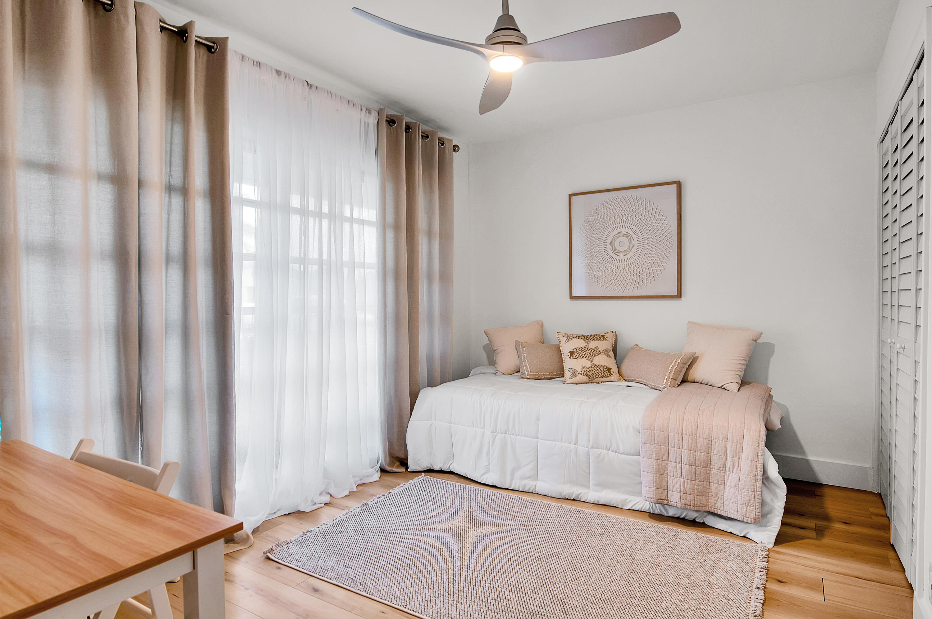 8799 Bella Vista Drive, Unit 2780 Boca Raton, FL 33433 - Photo 26 of 59 a bedroom with a bed and a chandelier