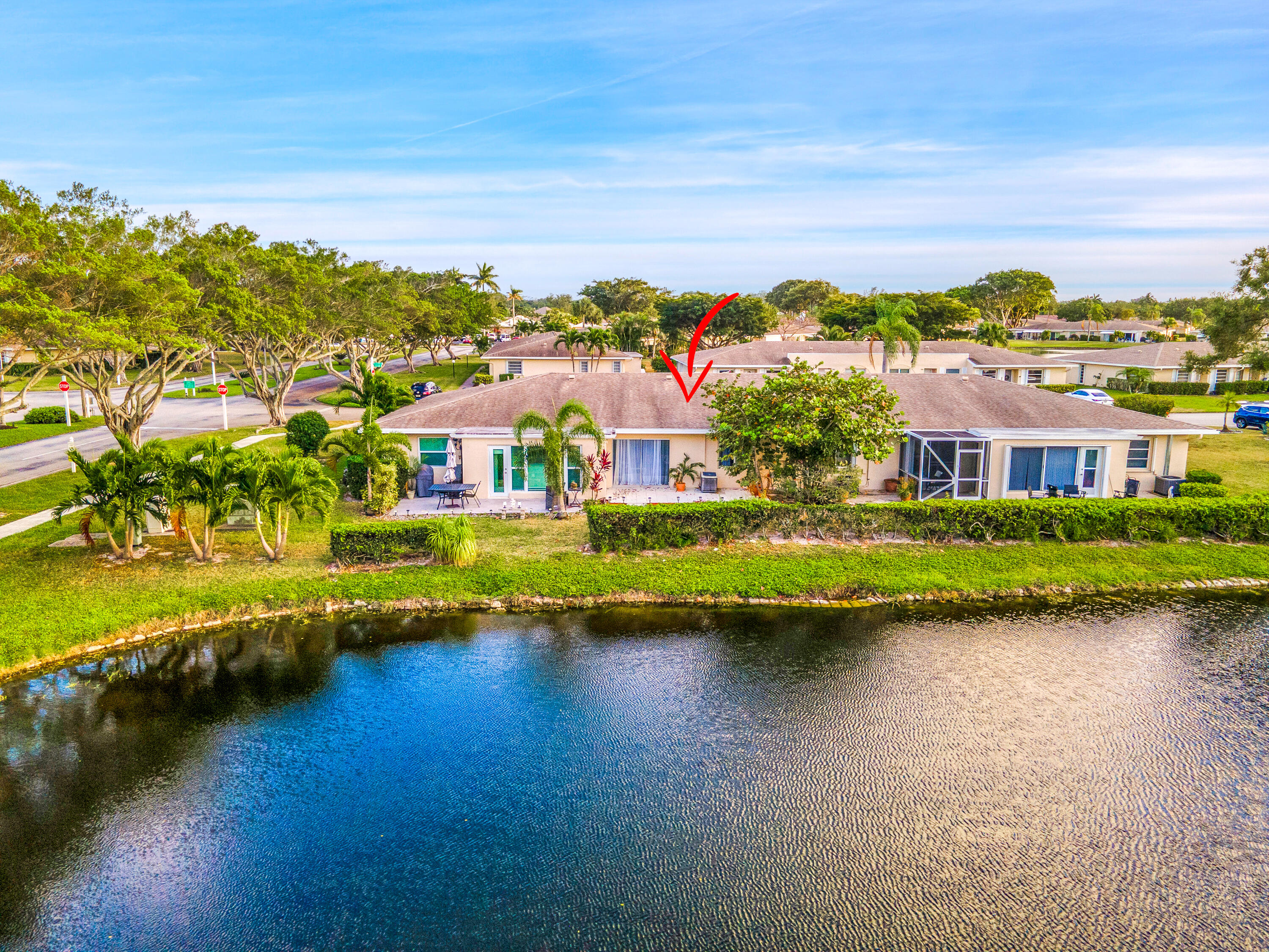 8799 Bella Vista Drive, Unit 2780 Boca Raton, FL 33433 - Photo 38 of 59 a view of a lake with houses