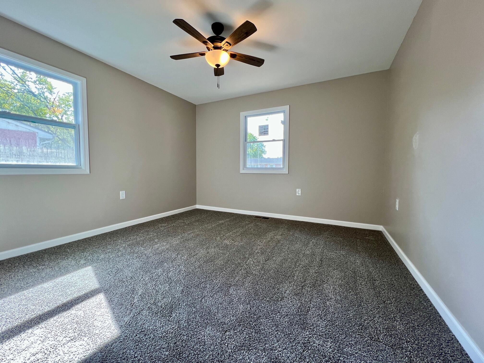 753 Imperial Road Valparaiso, IN 46385 - Photo 4 of 10 wooden floor in an empty room with a window