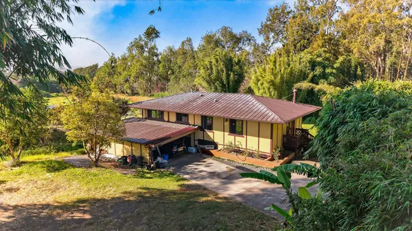 a house with trees in the background