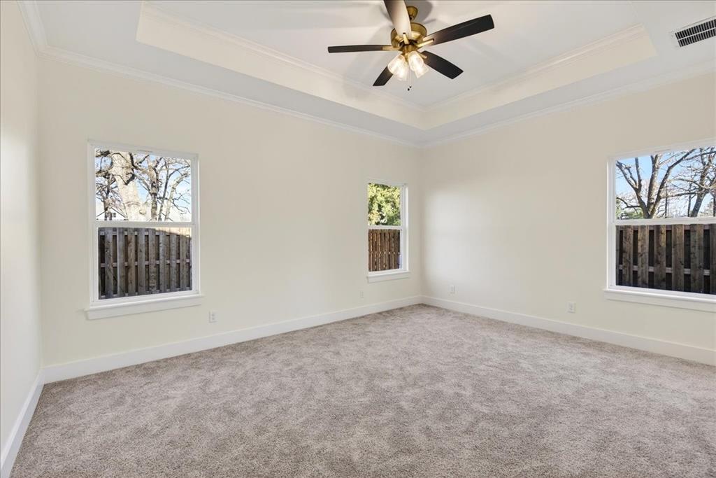 114 Castlewood Road Enchanted Oaks, TX 75156 - Photo 18 of 33 an empty room with windows and fan