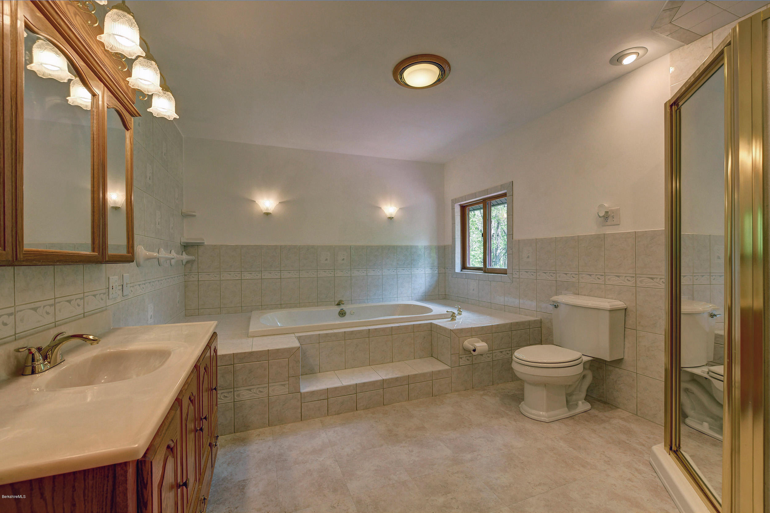 5 N Road Peru, MA 01235 - Photo 20 of 43 a bathroom with a granite countertop sink mirror vanity and toilet