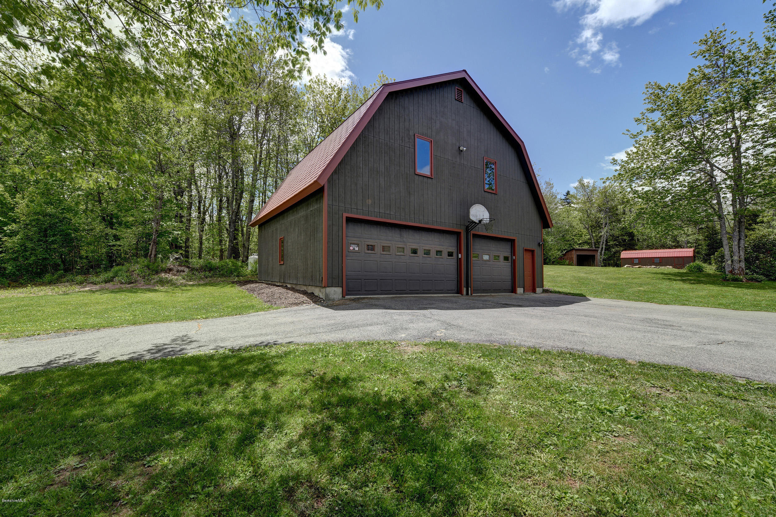 5 N Road Peru, MA 01235 - Photo 4 of 43 a front view of a house with a yard and garage