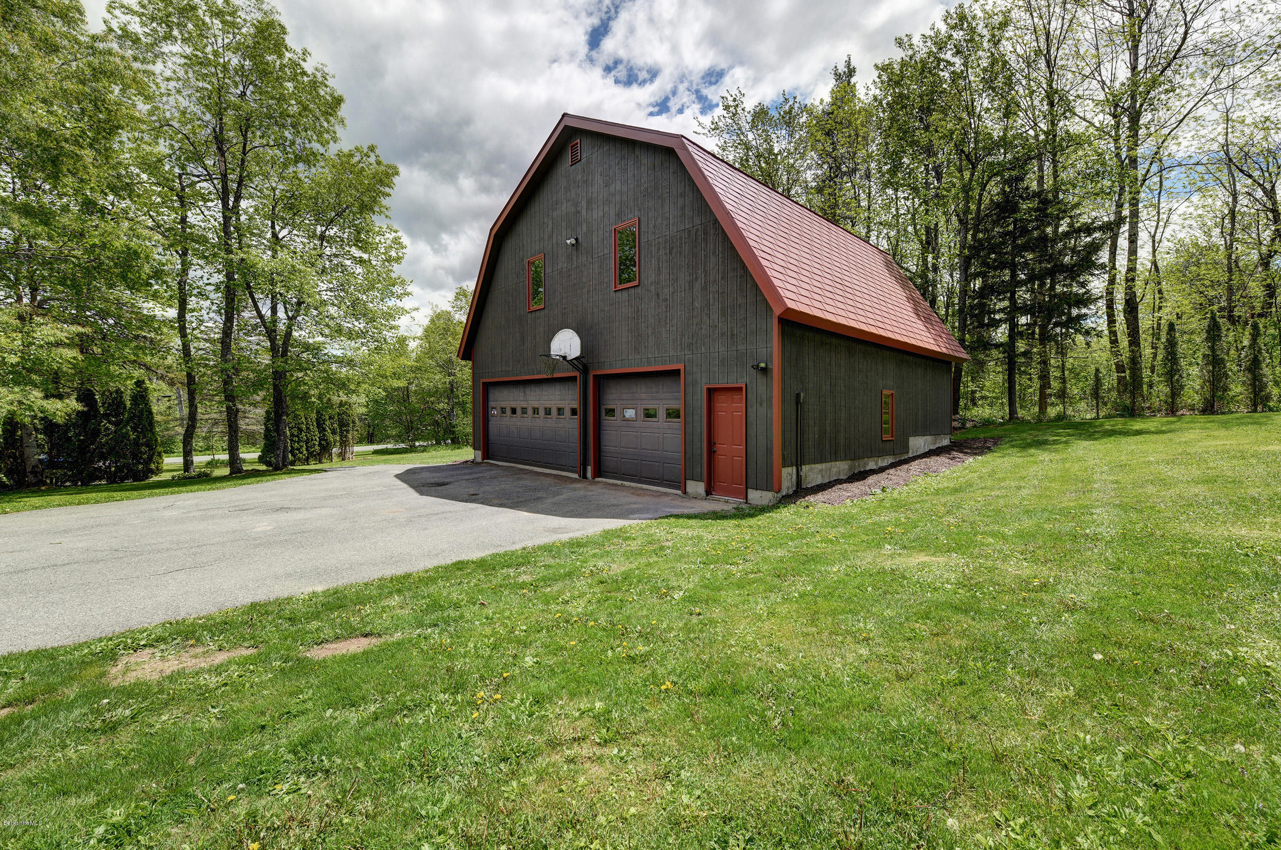 5 N Road Peru, MA 01235 - Photo 33 of 43 a front view of a house with a yard and trees