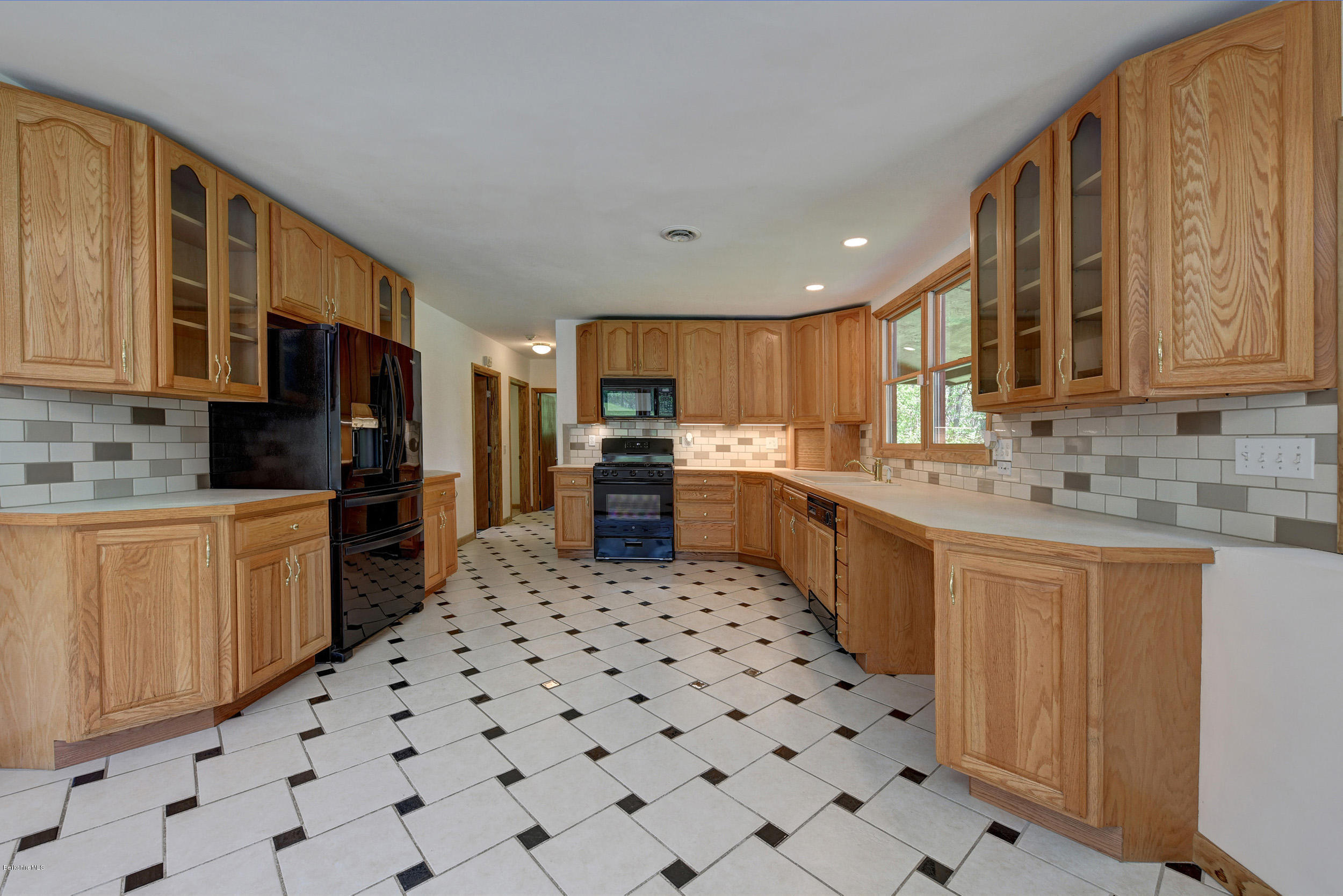 5 N Road Peru, MA 01235 - Photo 9 of 43 a kitchen with stainless steel appliances a refrigerator sink and cabinets