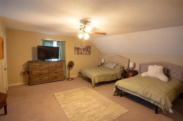 a view of a livingroom with furniture and a window