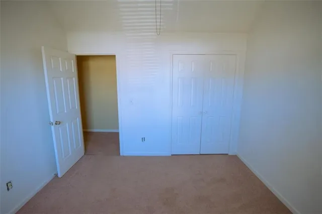 a kitchen with kitchen island a counter top space appliances and a refrigerator