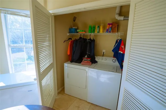 a kitchen with stainless steel appliances a stove sink and cabinets