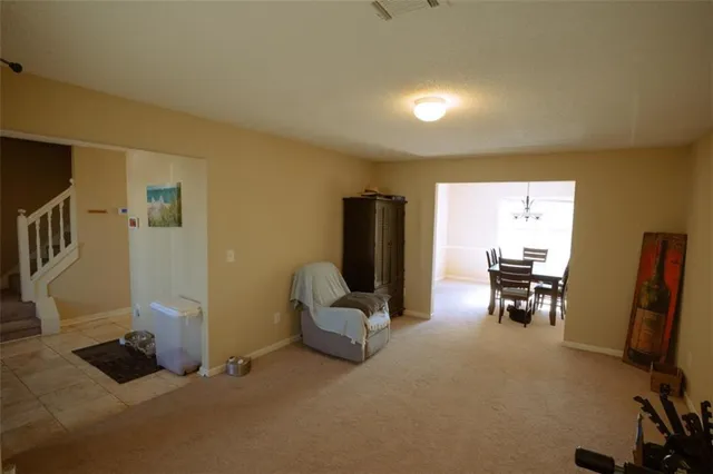 a view of living room with furniture and a flat screen tv