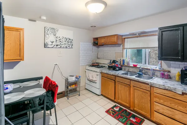 a kitchen with a sink cabinets and appliances