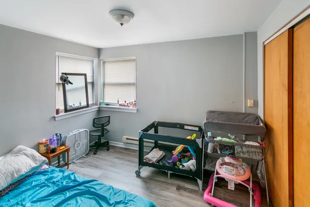 a bedroom with furniture and a window