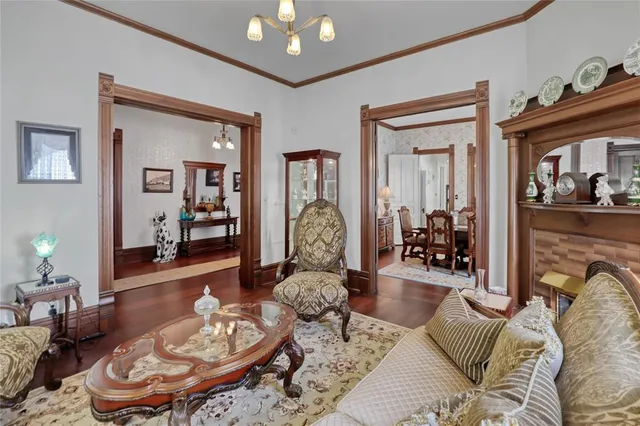 a view of a dining room with furniture and chandelier