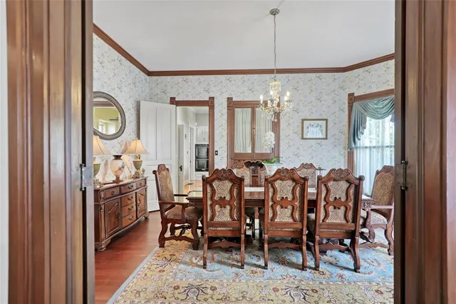 a kitchen with stainless steel appliances a sink stove and cabinets