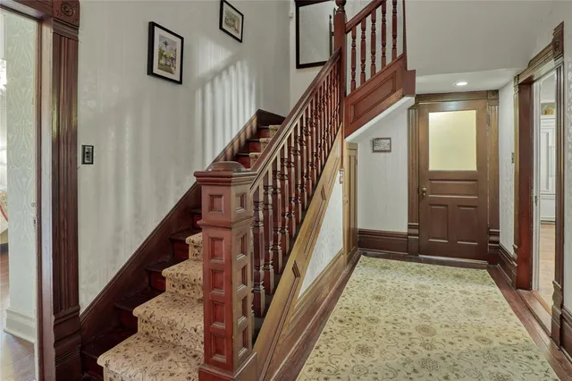 a hallway with table and chairs