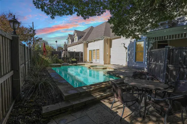 a view of yard with swimming pool and outdoor seating
