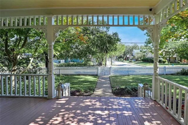 a view of a street with a garden
