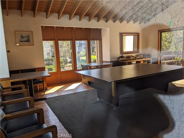 a room with table tennis and stairs