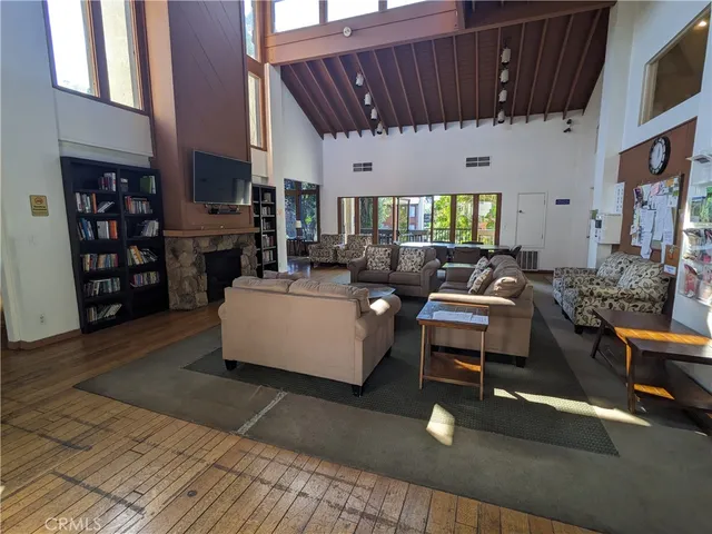 a living room with furniture a fireplace and a window