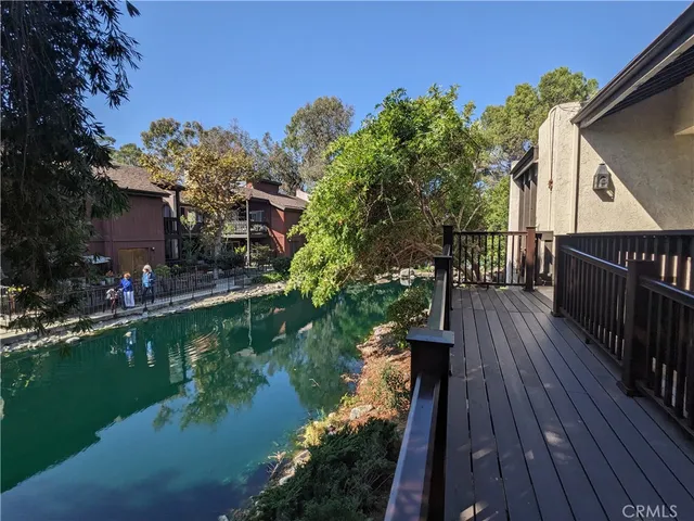 a view of a house with backyard patio and garden