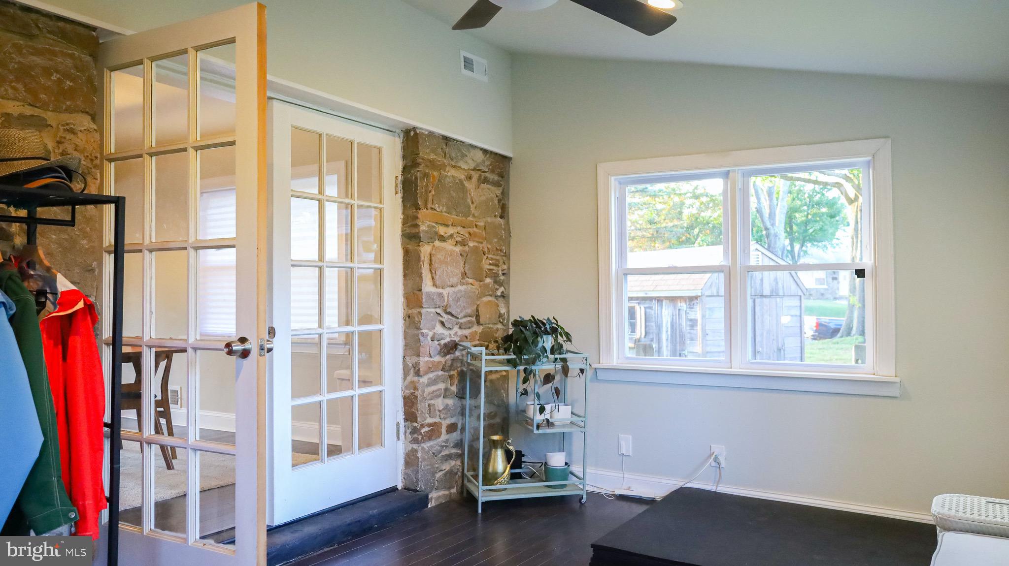 8902 Flagstone Circle Randallstown, MD 21133 - Photo 15 of 46 Sun Room Touts Stone Features, and High Ceilings