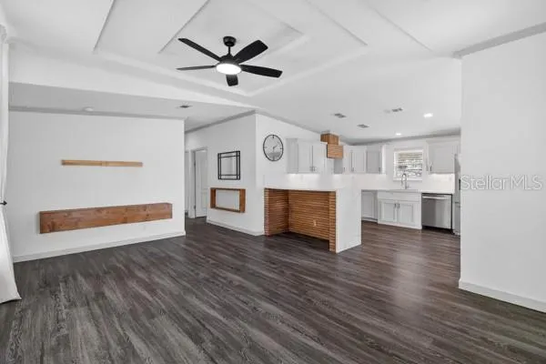 a room with wooden floor and a window
