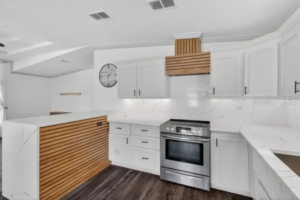 a kitchen with appliances cabinets and a sink