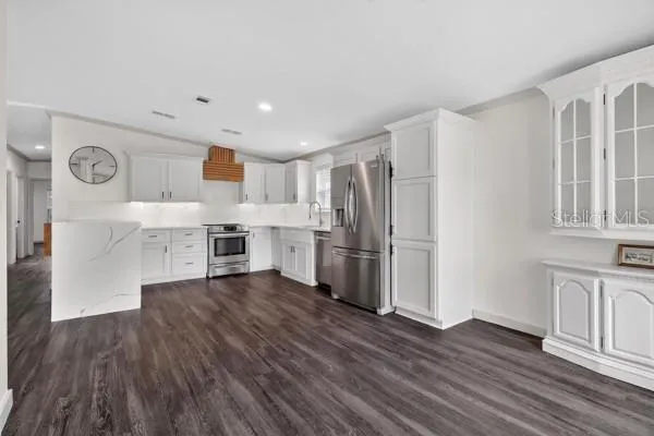 a view of a livingroom with wooden floor