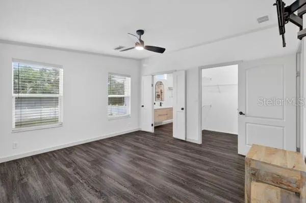 wooden floor with white walls