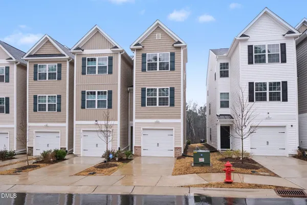 a view of multiple houses with a street