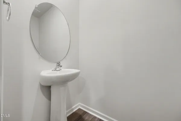 a bathroom with a sink and mirror