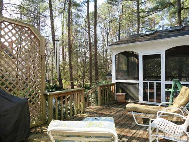 2613 Bembridge Drive Raleigh, NC 27613 - Photo 23 of 25 The lg Deck has a lattice privacy fence and overlooks the wooded backyard. Patio/Deck