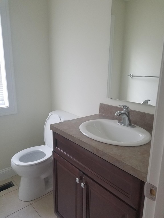 23 Beech Street Springfield, MA 01105 - Photo 7 of 10 a bathroom with a sink and a toilet