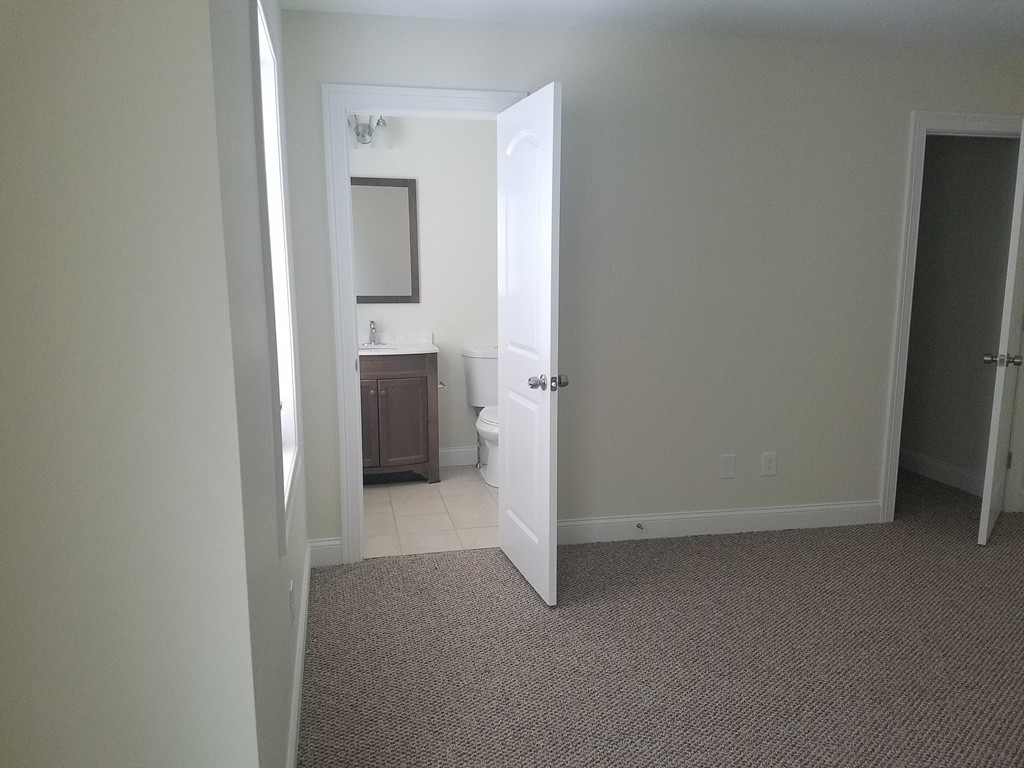 23 Beech Street Springfield, MA 01105 - Photo 10 of 10 a view of a hallway with an empty room
