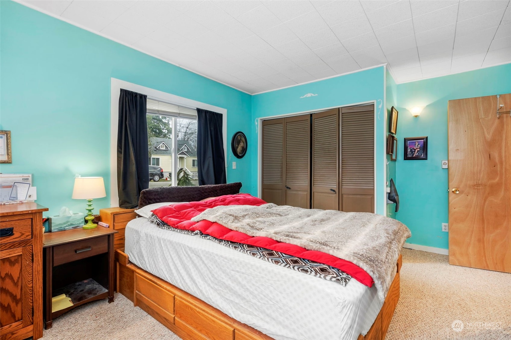 5807 Lowell Road Everett, WA 98203 - Photo 14 of 30 a bedroom with a bed closet and a window