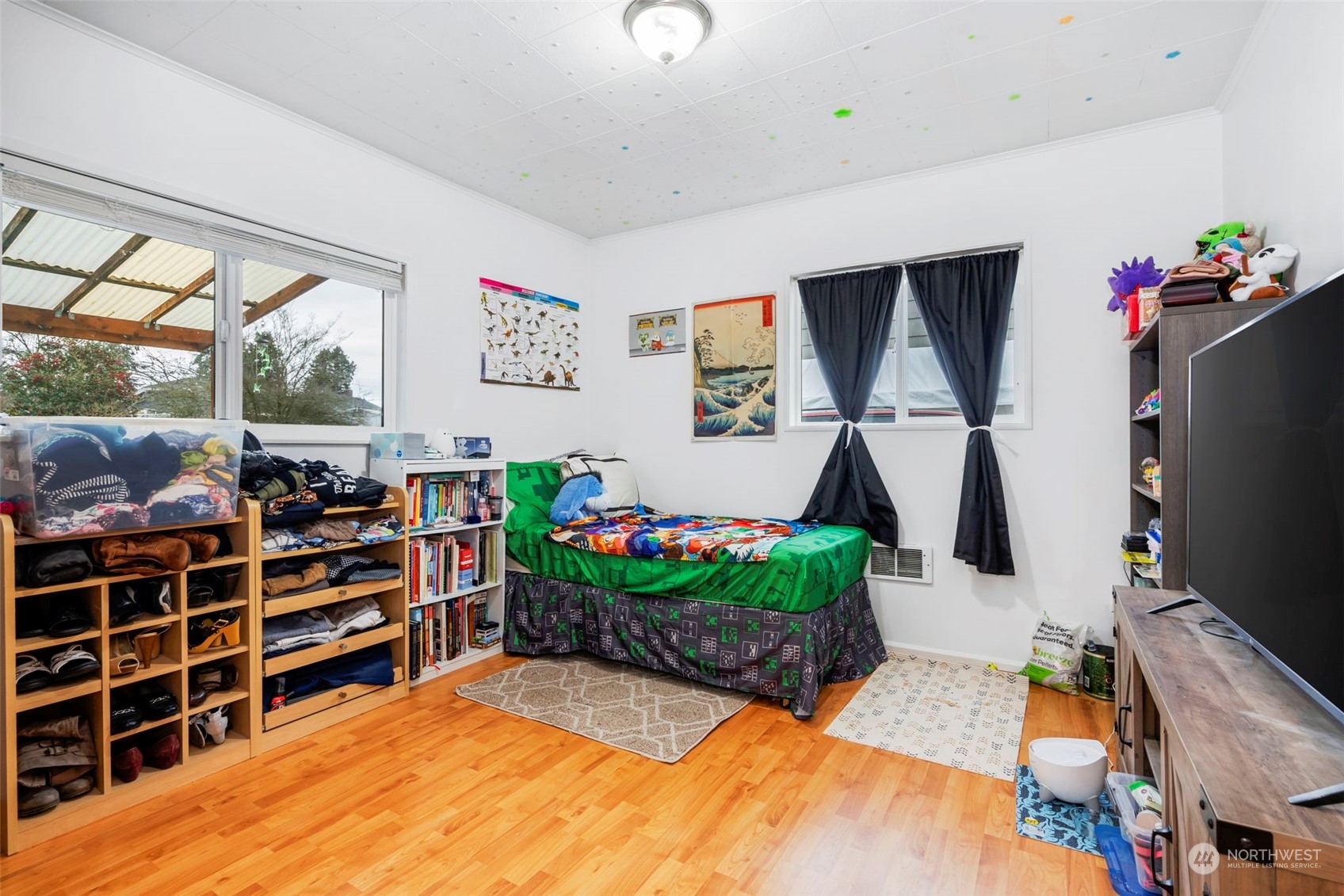 5807 Lowell Road Everett, WA 98203 - Photo 15 of 30 a room with furniture and a flat screen tv