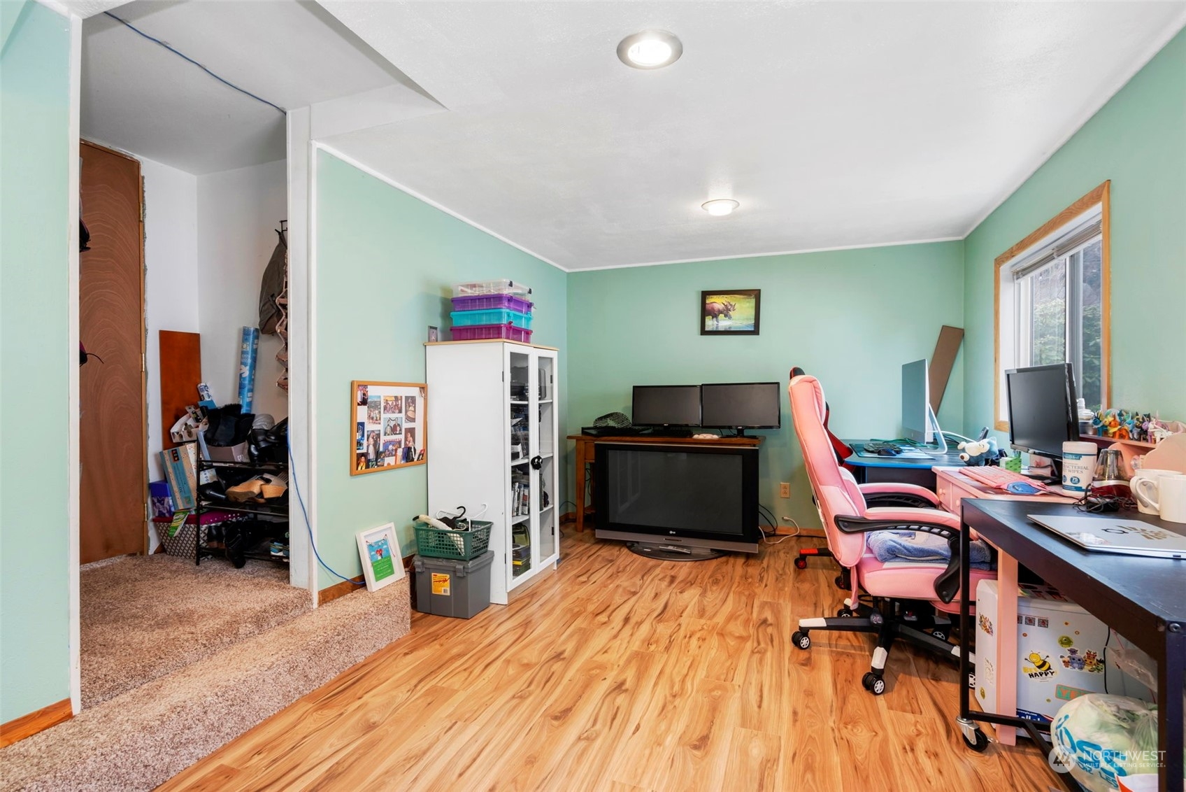 5807 Lowell Road Everett, WA 98203 - Photo 17 of 30 a workspace with furniture and wooden floor