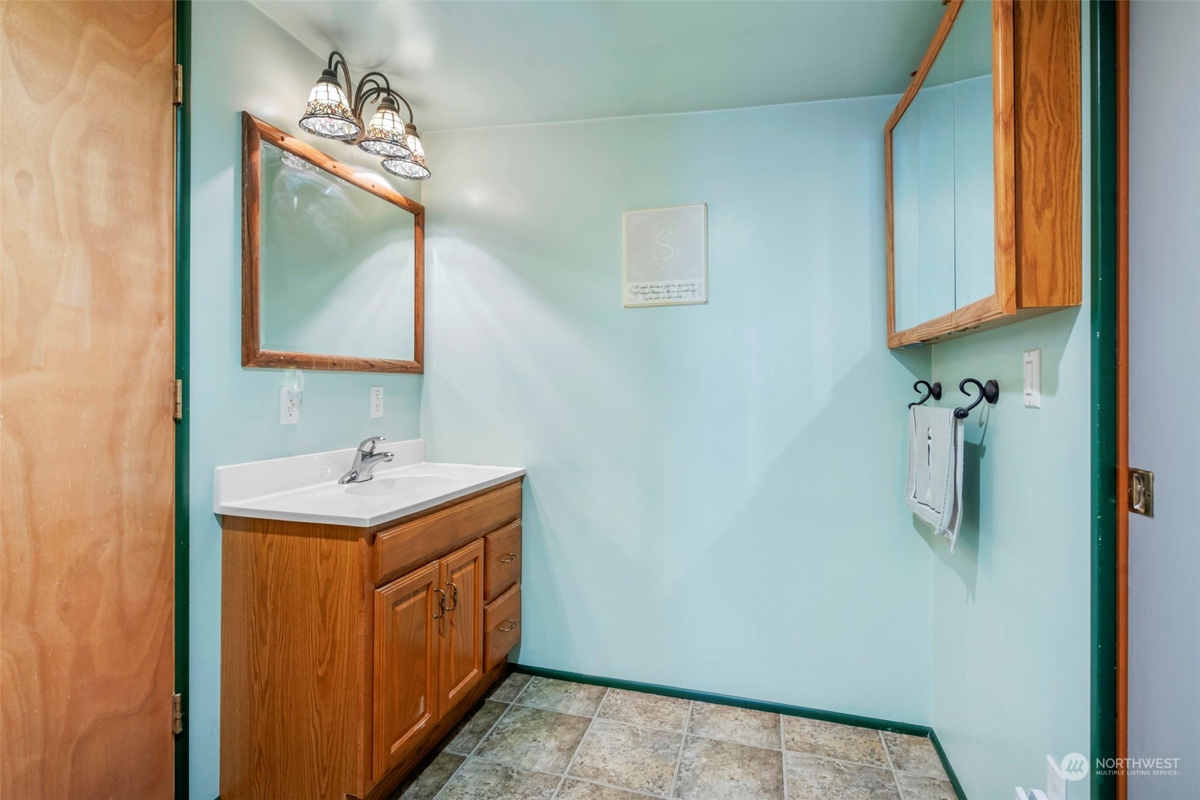 5807 Lowell Road Everett, WA 98203 - Photo 24 of 30 a bathroom with a double vanity sink and mirror