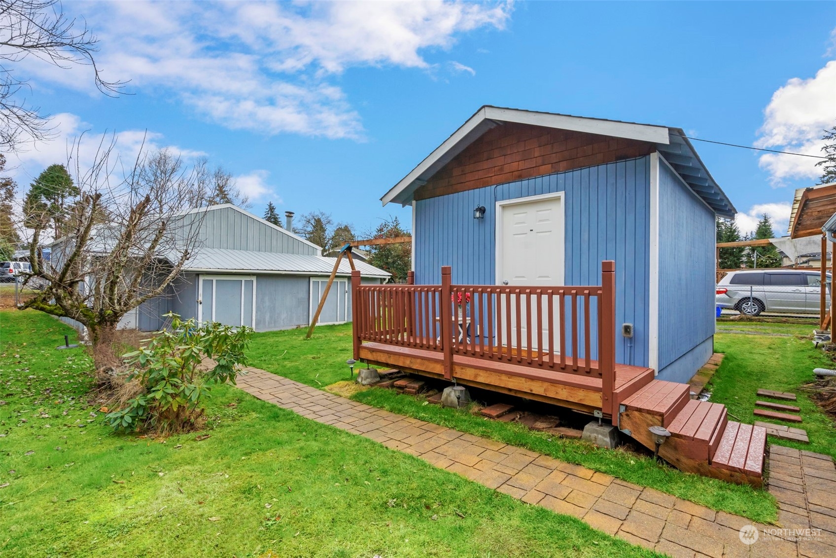 5807 Lowell Road Everett, WA 98203 - Photo 26 of 30 a view of a house with a yard and deck