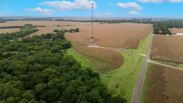 a picture of houses with a yard and ocean view