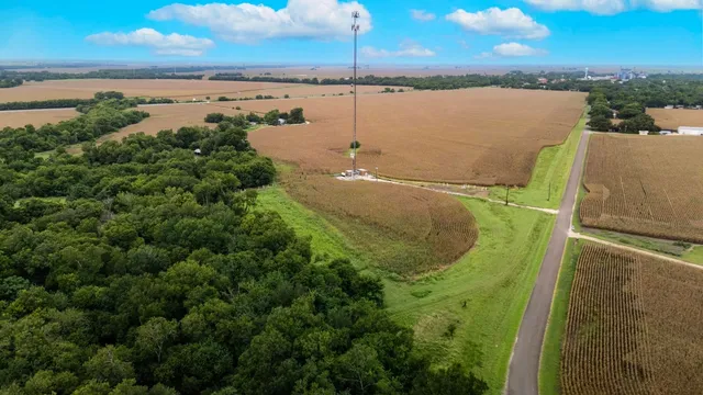 a backyard of a house with a yard and outdoor seating