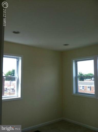 233 Arden Road West Baltimore, MD 21225 - Photo 7 of 10 a view of a room that has a window in it