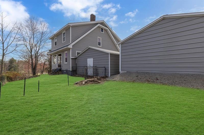 3159 Brodhead Road Aliquippa, PA 15001 - Photo 27 of 30 a front view of a house with patio and garden