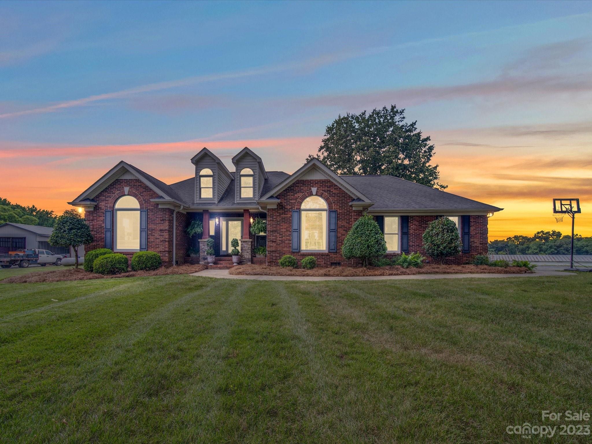 5817 Unionville Road Monroe, NC 28110 - Photo 1 of 46 a front view of a house with a yard