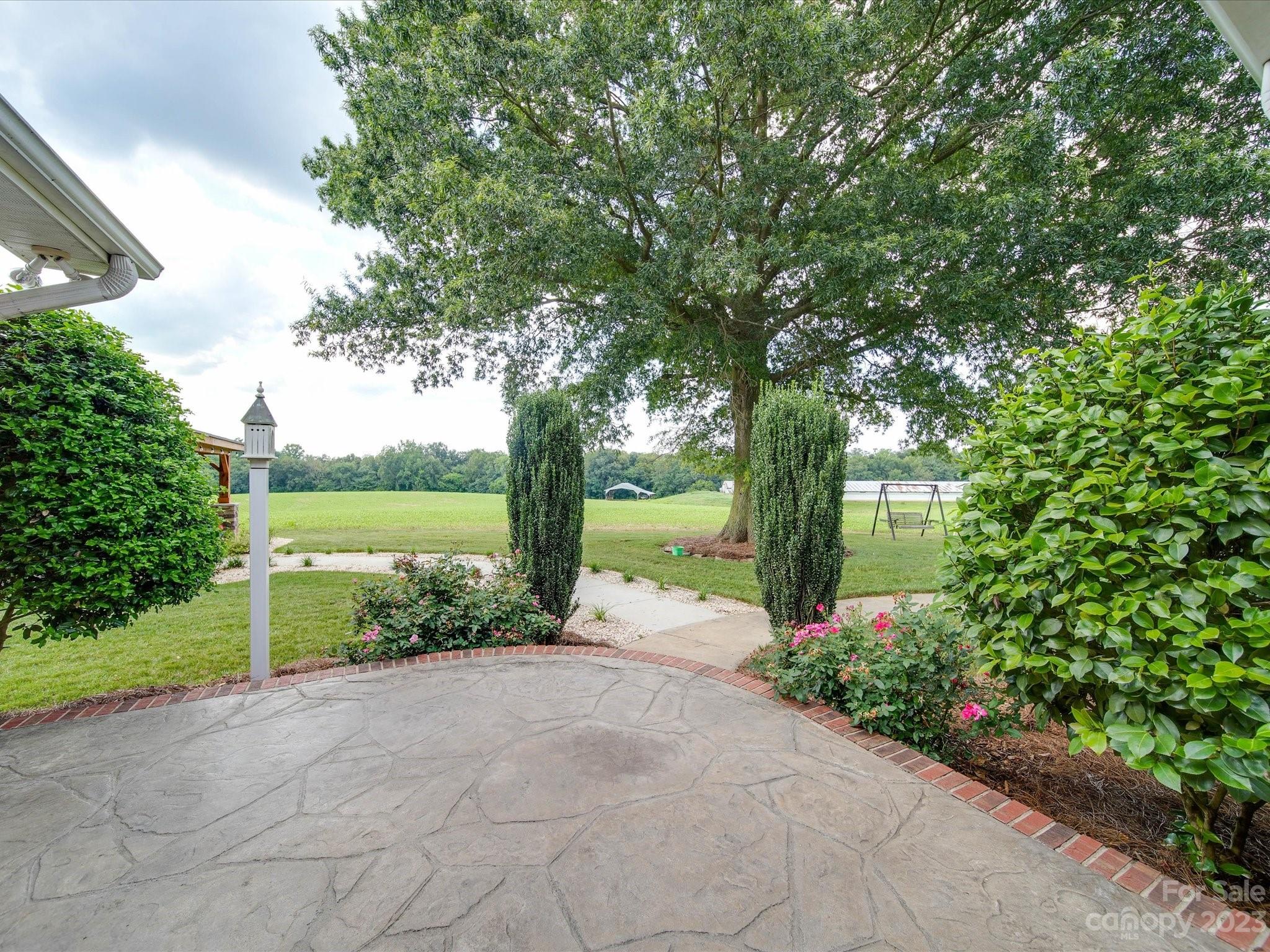 5817 Unionville Road Monroe, NC 28110 - Photo 11 of 46 a front view of a house with garden