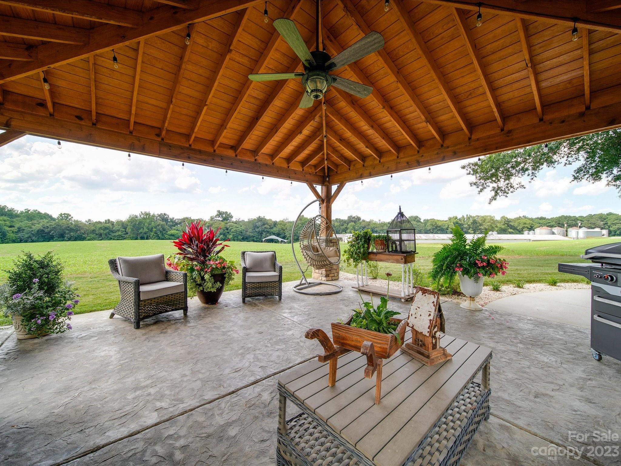 5817 Unionville Road Monroe, NC 28110 - Photo 13 of 46 a view of a backyard with sitting area